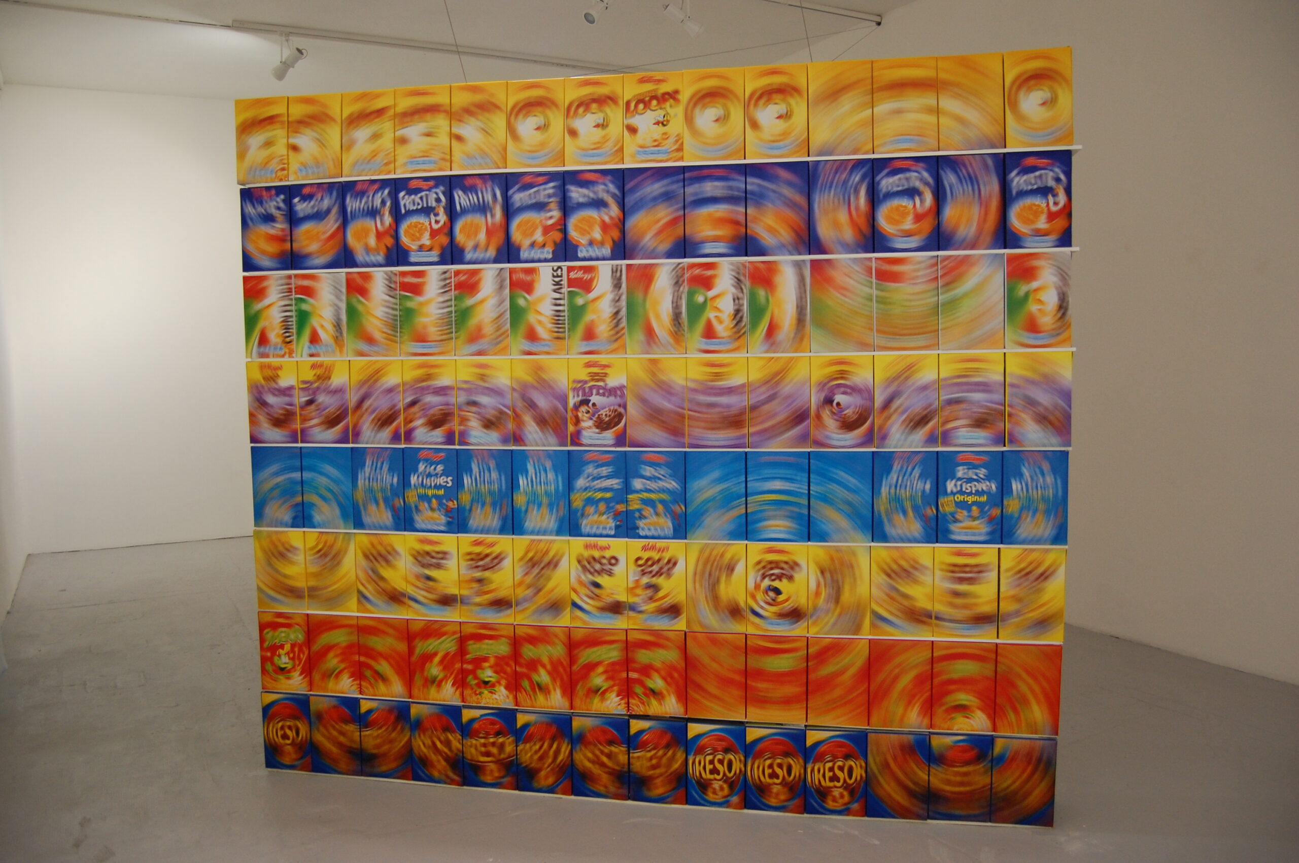 a thin but wide column of cereal boxes with their labels blurred into spirals